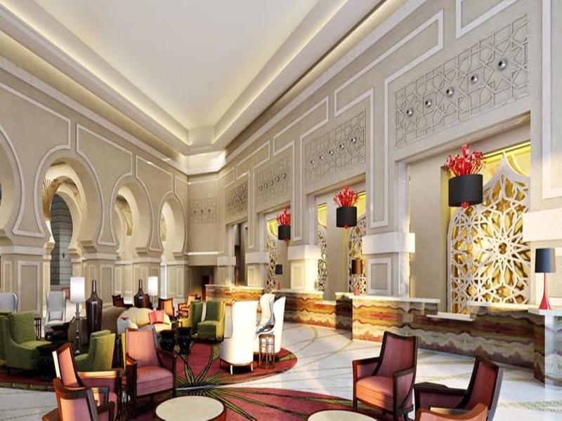 فندق جبل عمر ماريوت مكة المكرمة المظهر الخارجي الصورة The photo depicts an elegant hotel lobby characterized by its luxurious interior design. The space features high ceilings with intricate architectural details along the walls. Soft lighting enhances the warm ambiance, while decorative elements such a